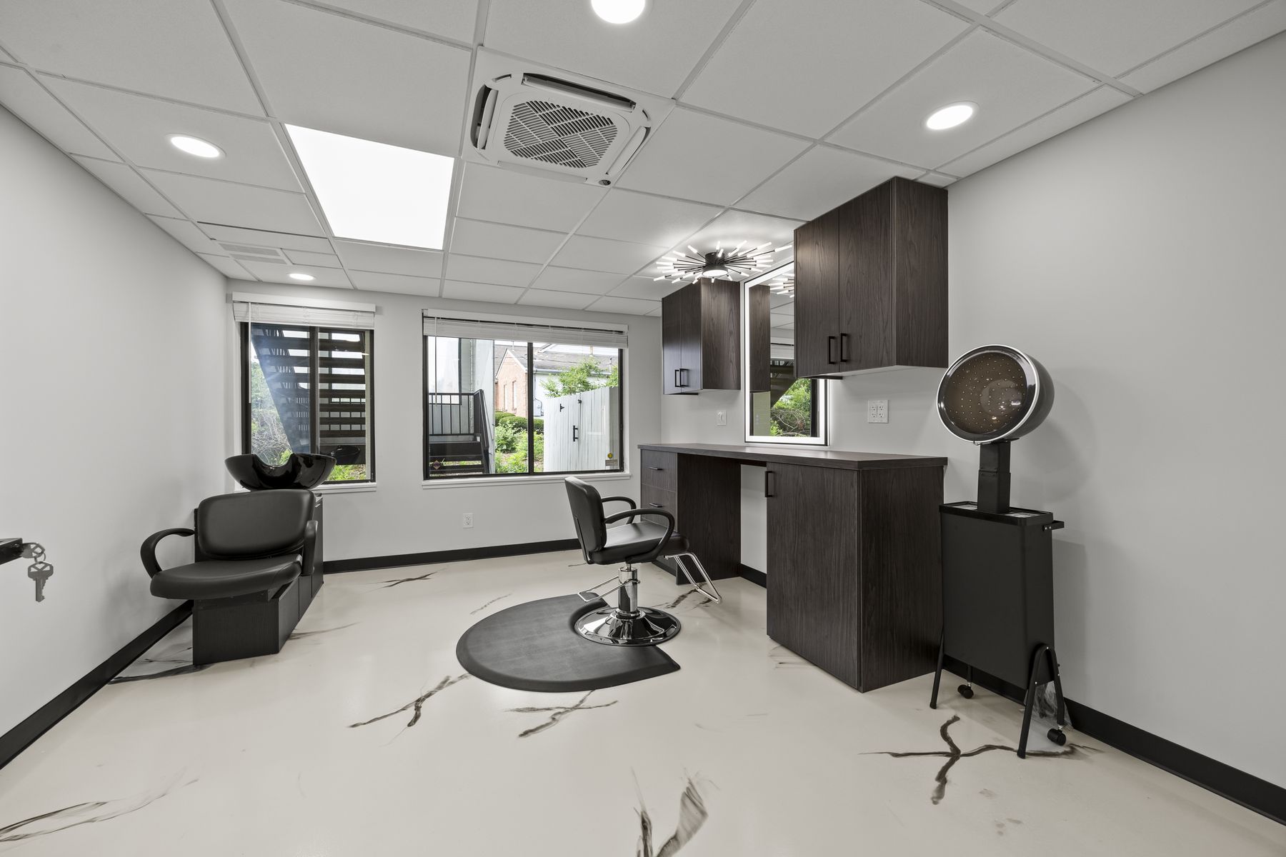 Hair suite with two windows and a hooded dryer